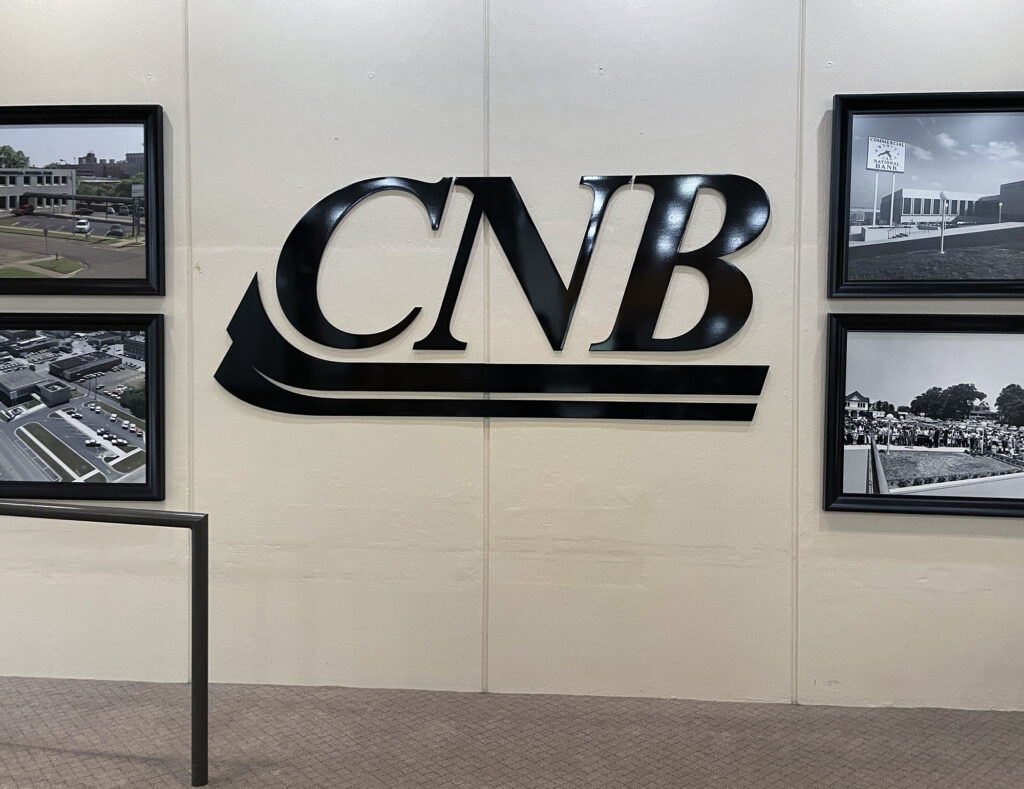 Interior flat-cut aluminum stud-mounted letters with brushed aluminum finish for Commercial National Bank