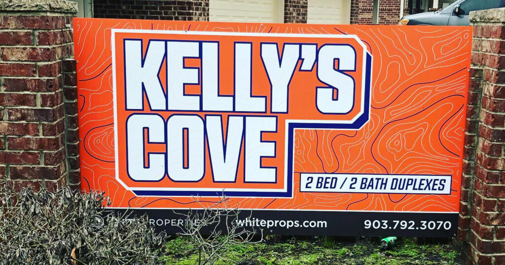 Monument sign for Kelly's Cove